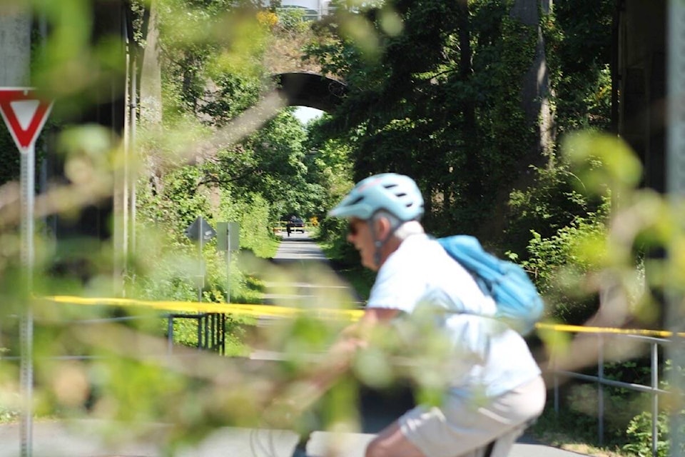 The Galloping Goose trail on May 25 as Saanich police investigate after a body was found in the area. (Jake Romphf/News Staff)