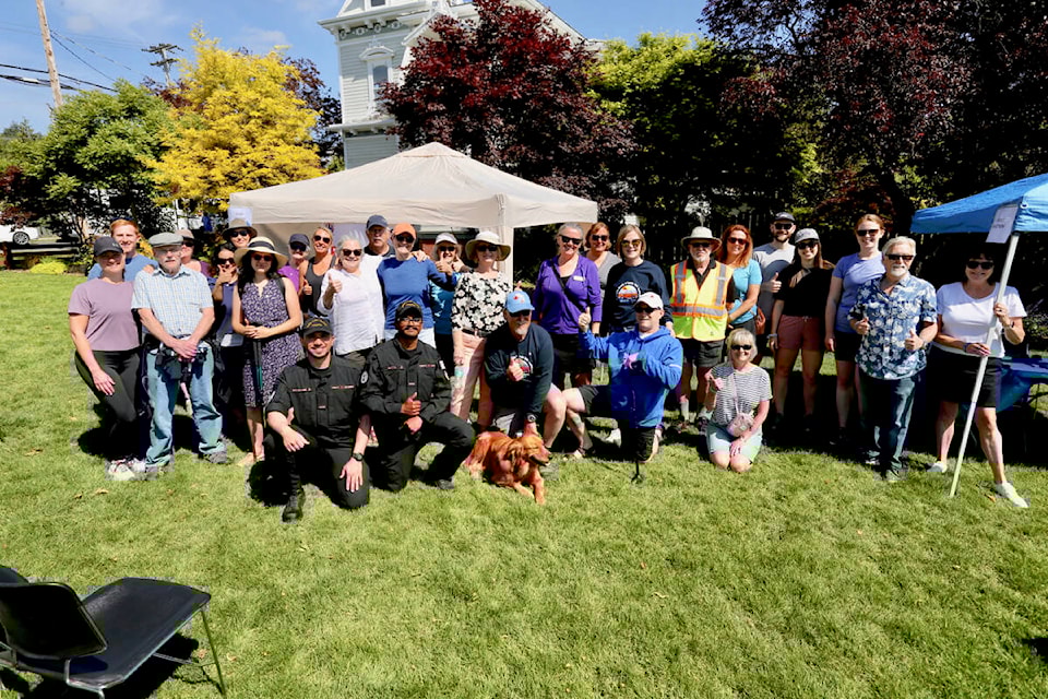 Huntington Hero Walk participants gather for a group photo before heading out on their five-kilometre awareness and fundraising walk Saturday, May 27 in Esquimalt. (Justin Samanski-Langille/News Staff)