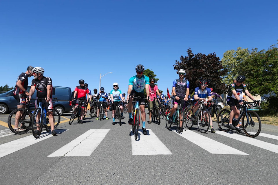 Riders warm up and chat ahead of the CFB Esquimalt 2023 Navy Nike Ride at Ecole John Stubbs Memorial School in Colwood Saturday, June 3. (Justin Samanski-Langille/News Staff)