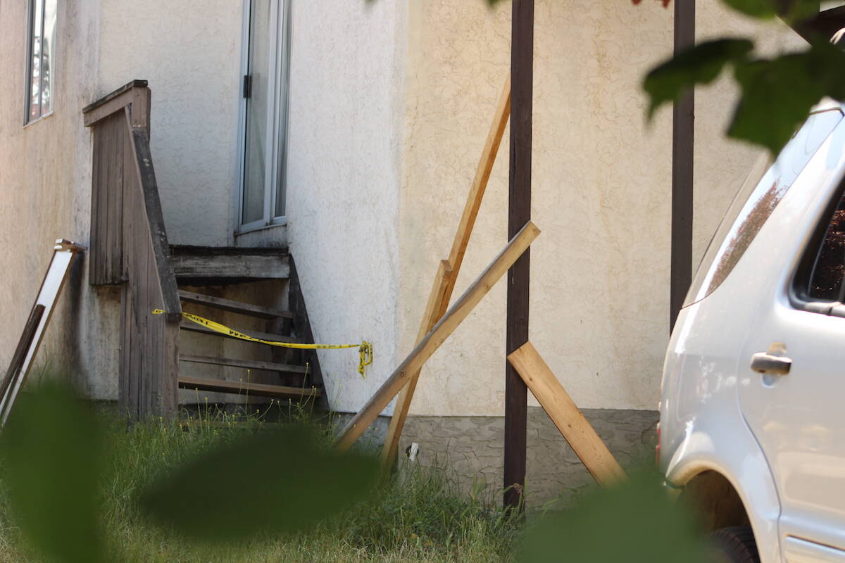 Boards supported the fire escape on June 7 that remains unsafe at a Cook Street apartment building. (Jake Romphf/News Staff)