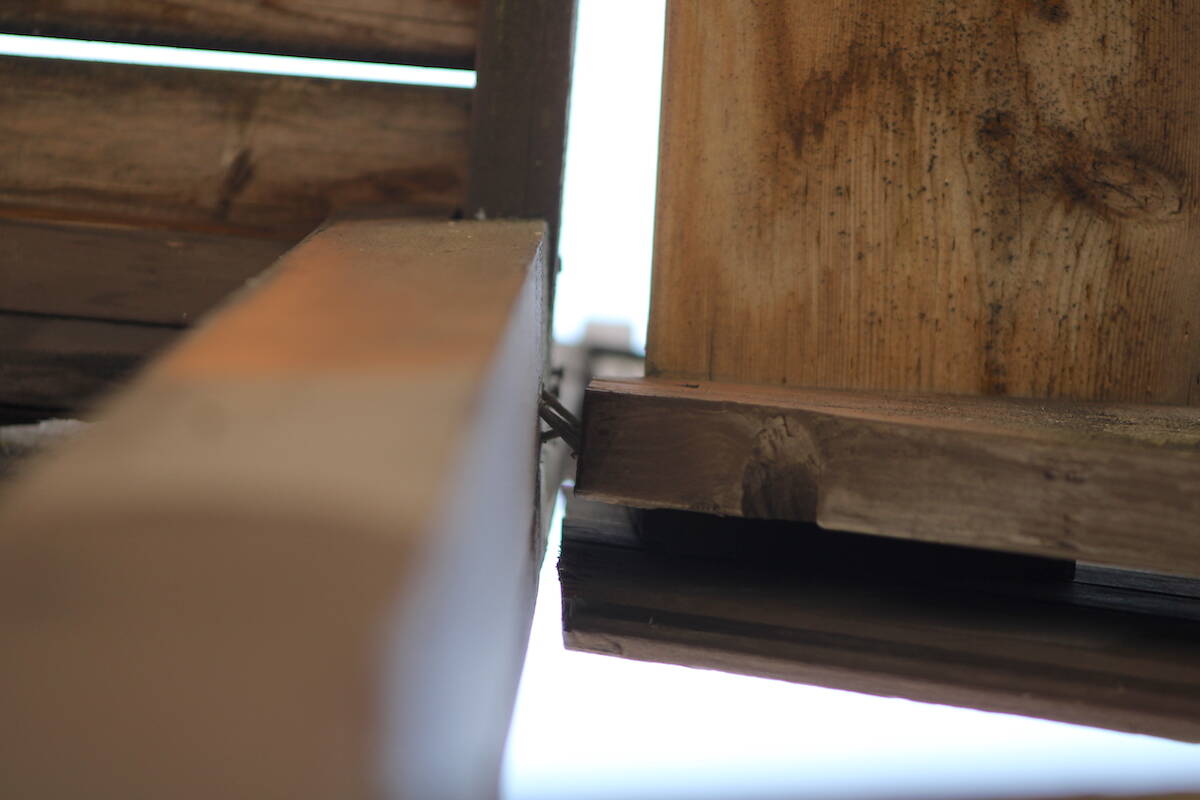 Separated boards near the top of a fire escape that remains unsafe at a Cook Street apartment building. (Jake Romphf/News Staff)