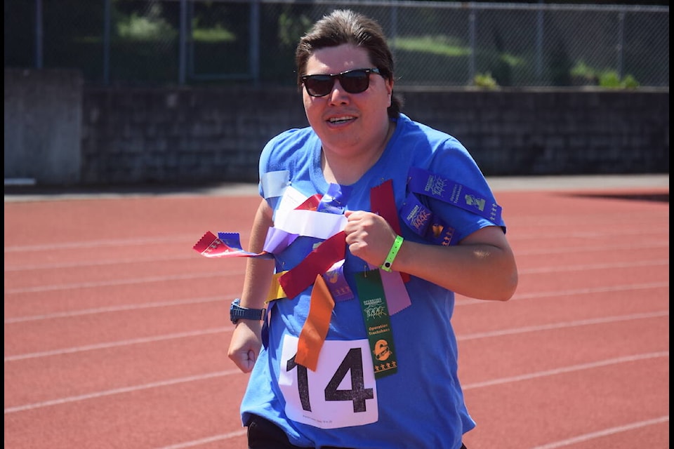 A competitor runs in the 1500-metre race during the final Operation Trackshoes Sunday (June 11). (Brendan Mayer/News Staff)