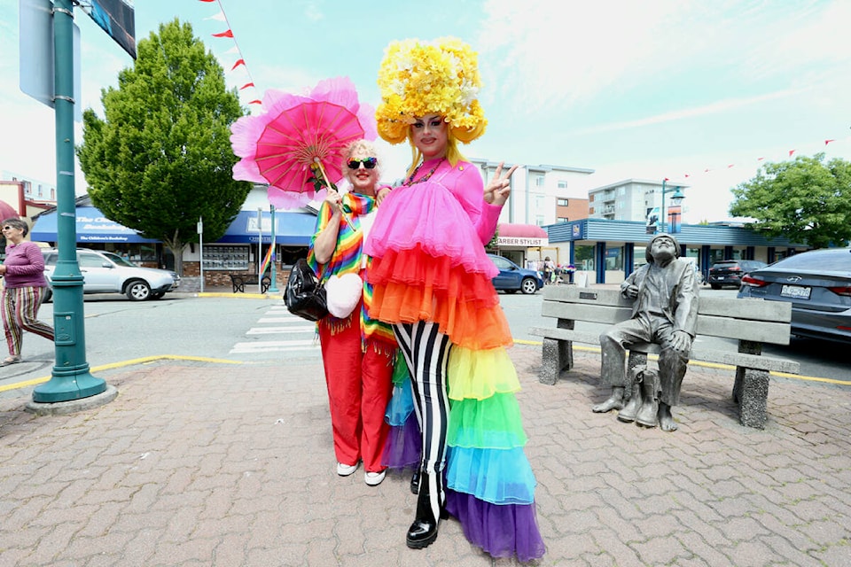 Alana Delcourt and Henrietta Dubet strike a pose while browsing the shops celebrating Pride Day in Sidney Saturday, June 17. (Justin Samanski-Langille/News Staff)