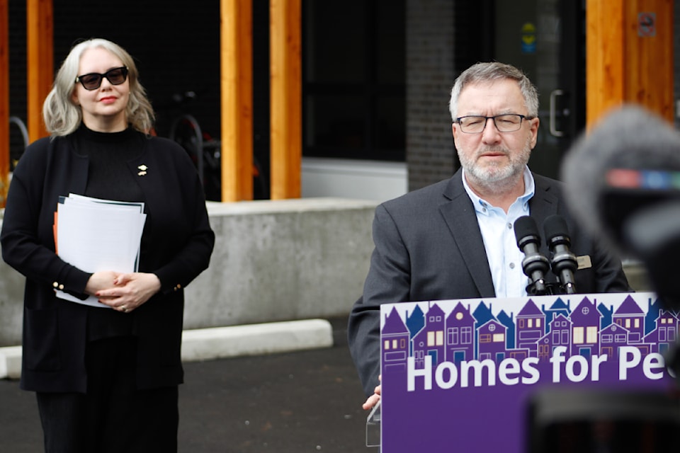 Victoria-Swan Lake MLA Nina Krieger, left, and Greater Victoria Housing Society director of real estate development James Monroe announce the opening of 530 new rental units in Greater Victoria on March 25.