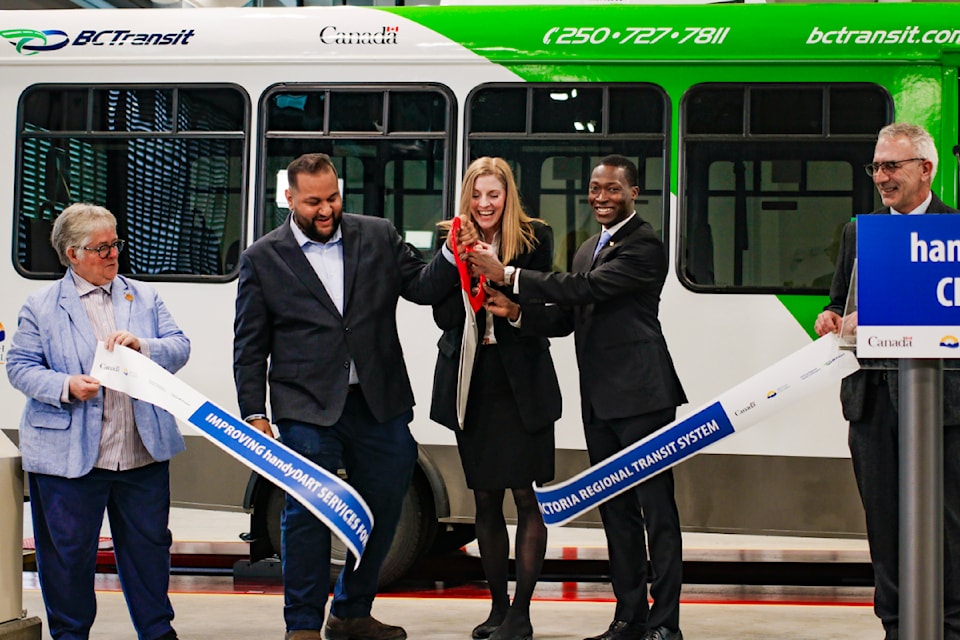 Victoria Mayor Marianne Alto, left, Langford-Juan de Fuca MLA Ravi Parmar, BC Transit president and CEO Erinn Pinkerton, Parliamentary Secretary for Transit George Anderson, and View Royal Mayor Sid Tobias cut the ribbon for the new handyDART facility in View Royal.