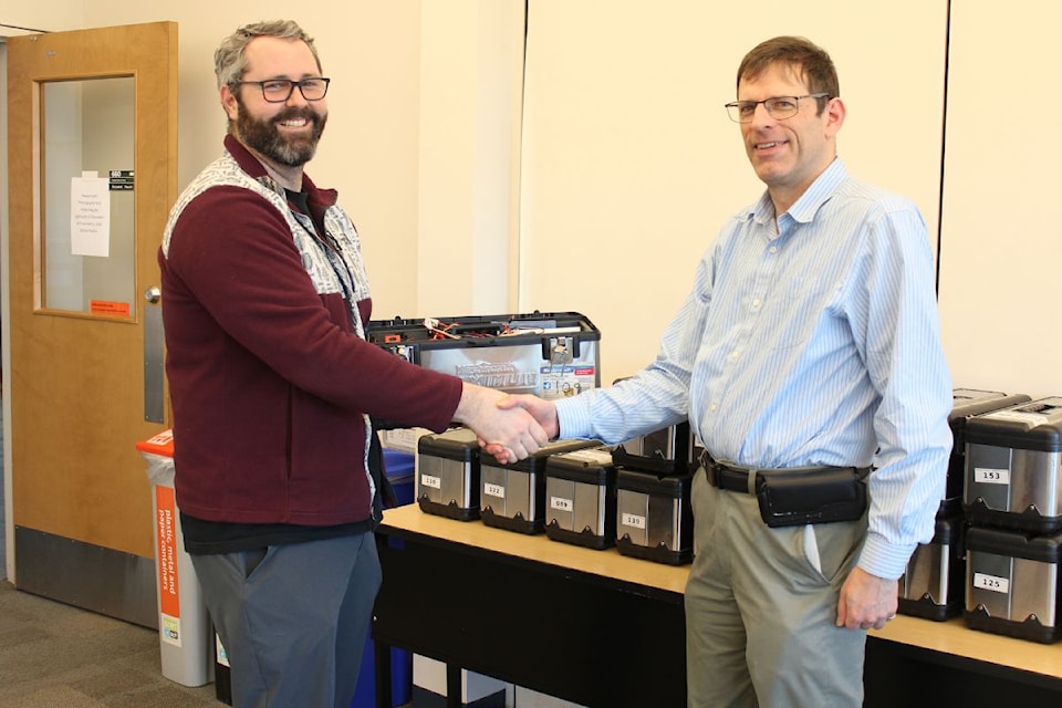 Kevin Wilcox, Mount Douglas teacher and robotics coach (left), and Michael McGuire, electrical and computer engineering chair.