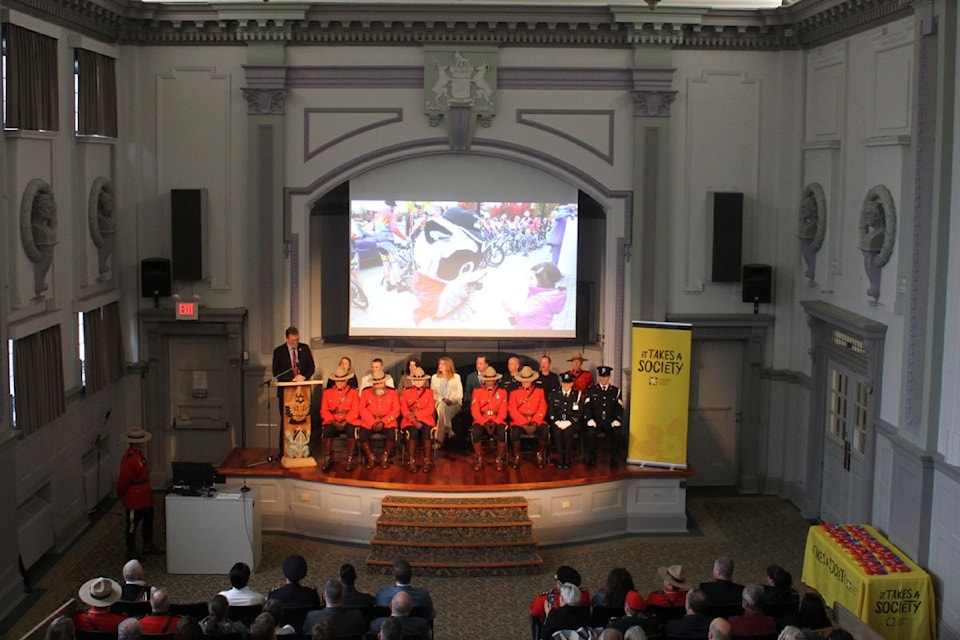 The 16 riders are  pictured here onstage during the official jersey presentation ceremony at Camosun College's Young Building.