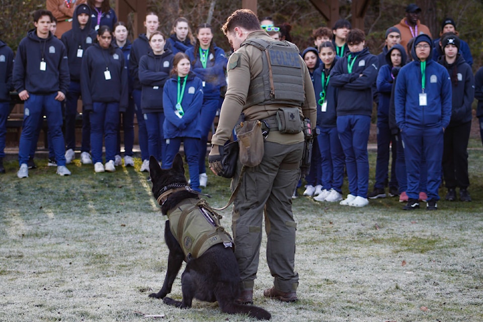 Police Camp students admire the police dog demonstration by the Integrated Canine Unit on Tuesday, March 18.
