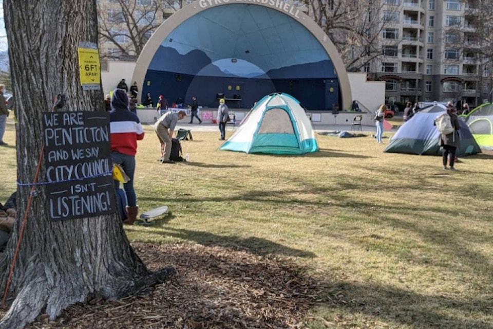 About 50 people gathered Friday, March 5, 2021 in Penticton to protest city council’s decision to close a temporary winter shelter. (Jesse Day - Western News)