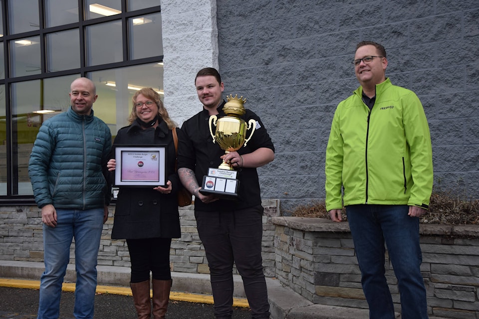 FreshCo manager Sean Watson presented the Roster Sports Bar and Grill team with the Golden trophy from NOCLS’ inaugural Golden Burger challenge Nov. 2. (Caitlin Clow - Vernon Morning Star)