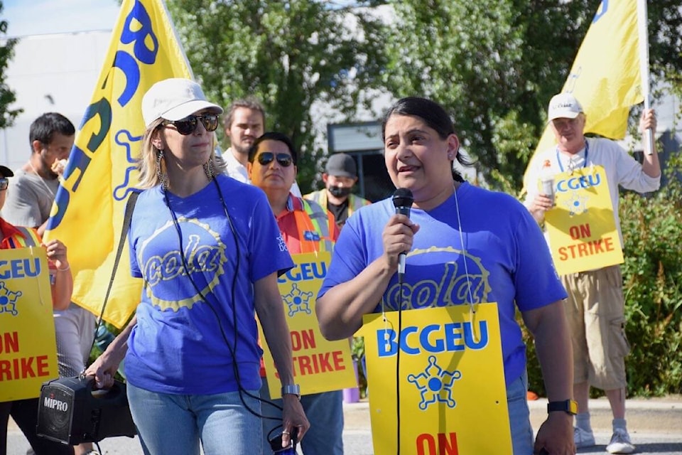 30092450_web1_220815-NDR-M-BCGEU-strike-Delta-59-BCGEU-vice-president-retail-stores-and-warehouse-Kusam-Doal-addresses-striking-workers-at-BCLDB-Delta-distrubution-centre
