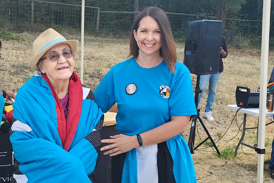 Agnes Haller, left, of Yunesit'in First Nation is honoured as a lifetime board member of Denisiqi Services Society by executive director Christa Smith during a 20 year anniversary celebration Thursday, Aug. 15. 