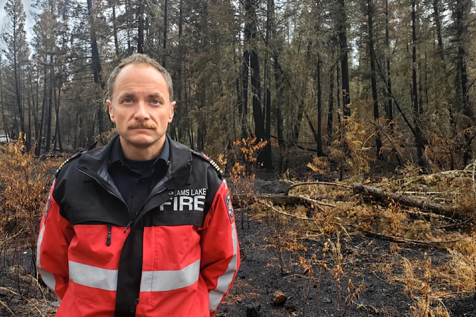 Williams Lake director of protective services Evan Dean in the river valley Monday, July 29, stands where the fire started on July 21. 