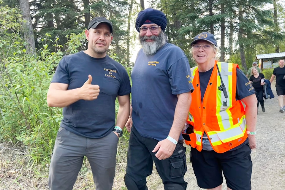 Citizens on Patrol volunteers Albert Slavik, Baldish Sunner, and Deb Pickering were helping out at Arts on the Fly on July 12.