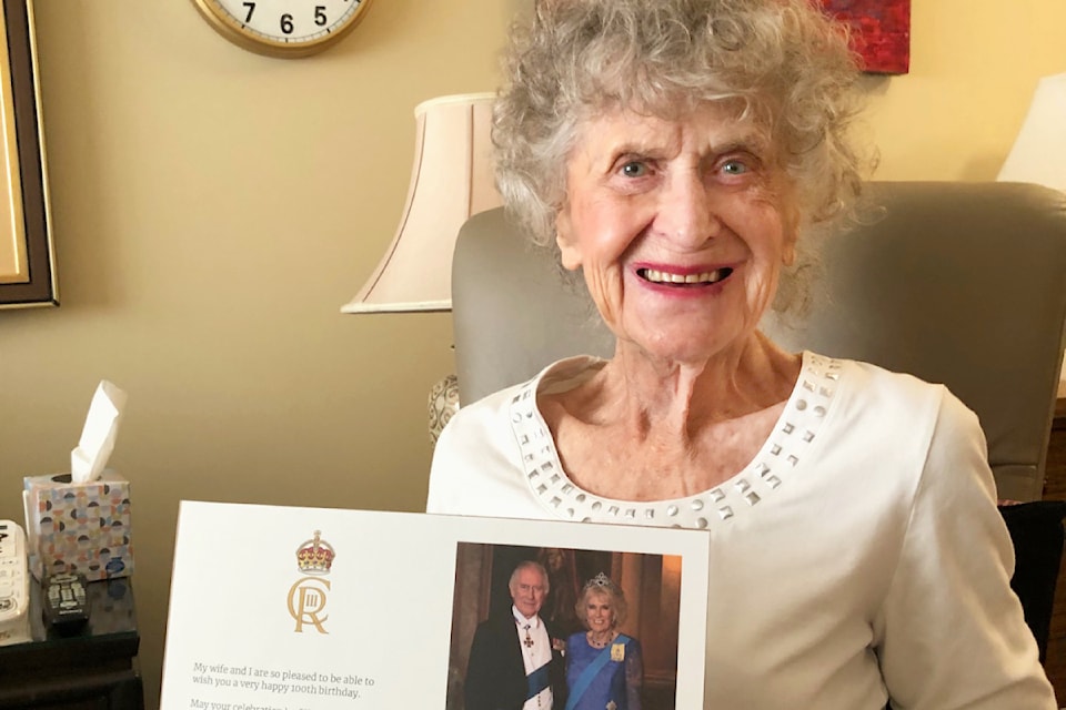 Peggy McKinlay shows off her letter from King Charles in recognition of her 100th birthday.