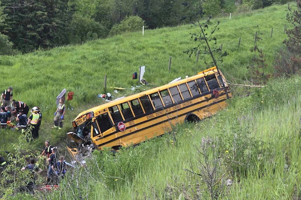 First responders work the scene of a school bus crash just north of lac la Hache on June 21 where several students and adults on the bus were injured. (Colton Hick photo/contributed to ronaldomanosa)
