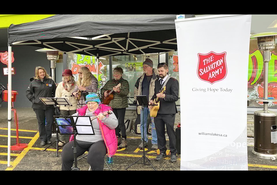 Community members and Salvation Army volunteers gathered in song at the Williams Lake FreshCo on Nov. 28 to mark the organization's Christmas Kettle Campaign kick off. 