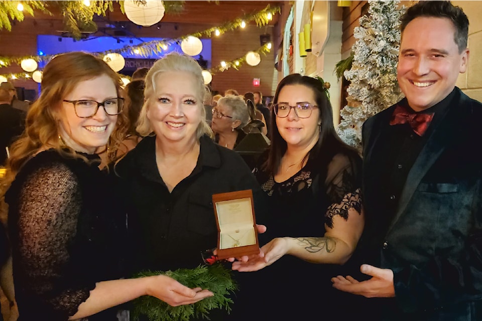 As the Cariboo Memorial Hospital Foundation gala got underway on Saturday, Nov. 16, at Sacred Heart Catholic Hall, Kendal Bourdon, left, Tammy Tugnum, Cori Van Horn and Geoff Bourdon show off the pendant Geoff designed and created for a raffle to be drawn later that night. 