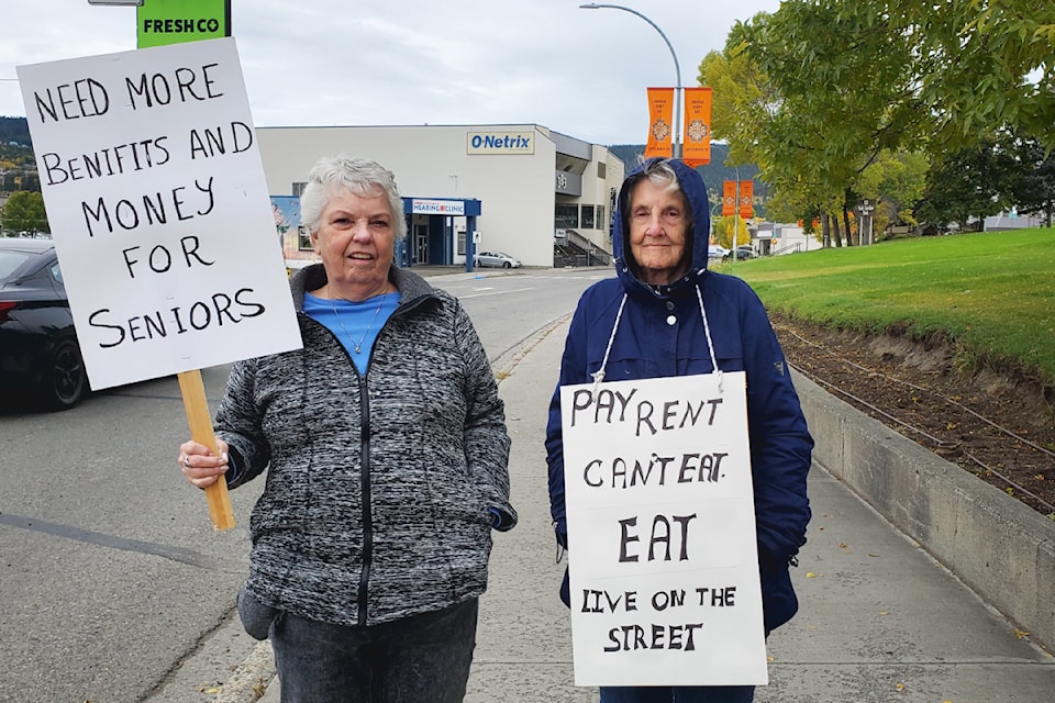 Rozetta Racher, left, and Nora Mark participate in a seniors tin cup rally Saturday, Oct. 5 in Williams Lake. 