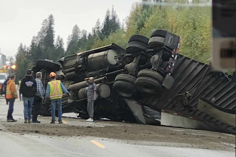 An overturned truck near Avola Thursday, Sept. 26, on Highway 5 results in single lane alternating traffic for clean-up. 