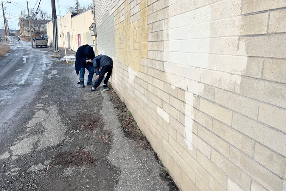Two people in an alley in Williams Lake.
