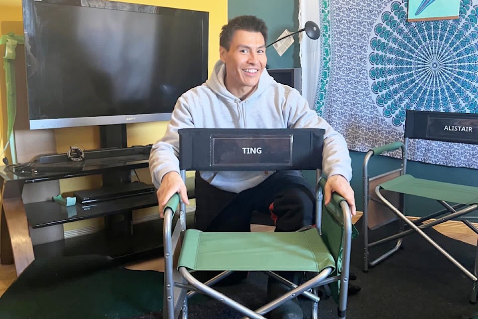 Kelly William, from Xatsull First Nation, poses with his actor's chair as Ting, one of the lead character's in the Netflix series North of North streaming on CBC Gem.