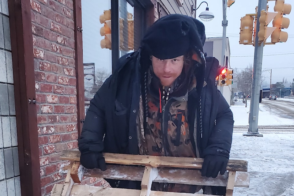 Cody Haines is out early Friday, Jan. 31 clearing snow in downtown Williams Lake. 