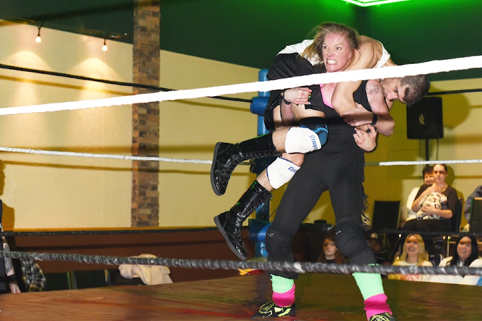 Local wrestler Hot Spice prepares to throw her opponent Stu Krewl during a Jan. 25 match.