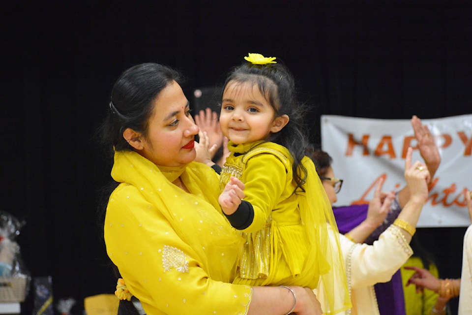 A woman and child dance during the Lohri celebration held on Saturday, Jan. 18 in Williams Lake. 