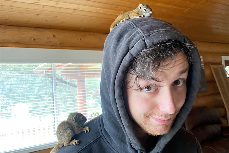 Blaine Chowace with the young squirrels he rescued.
