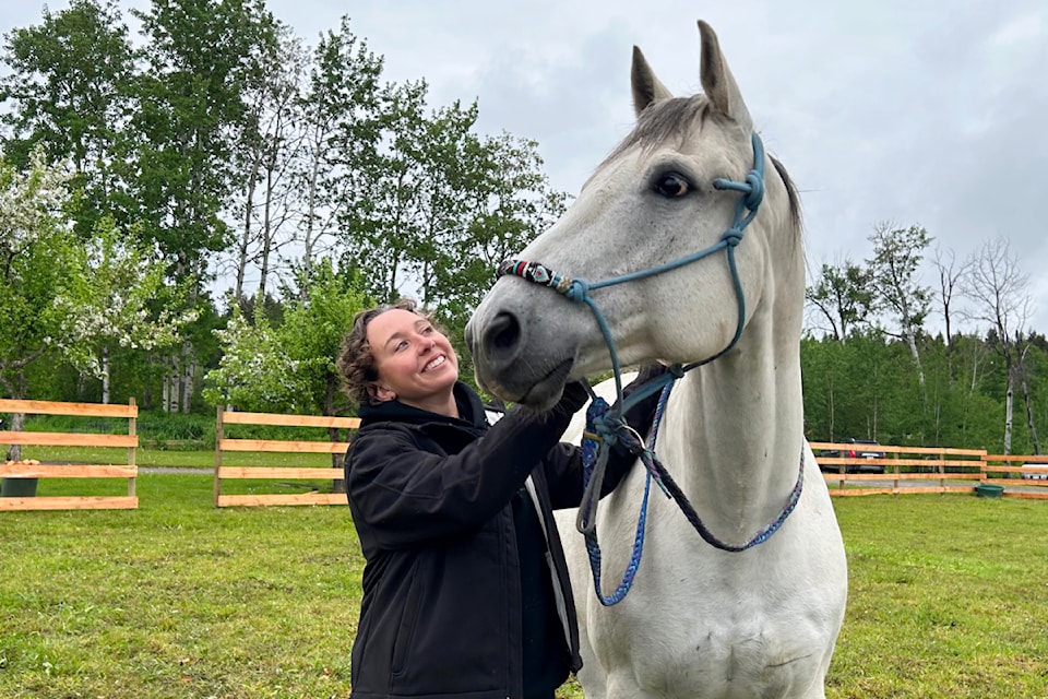 Meagan Bruneski with Beau, a 10-year-old former cutting horse at their home in Big Lake, northeast of Williams Lake. 