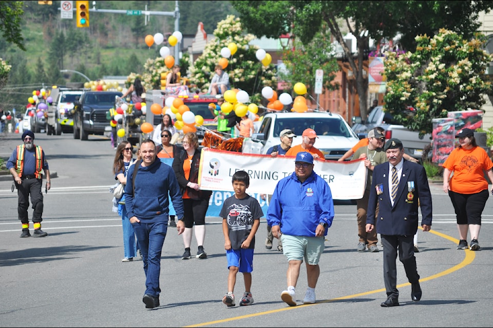 Williams Lake First Nation Chief Willie Sellars (left) leads the 2025 Indigenous Peoples Day parade through Williams Lake with Gordon Keener (right). 