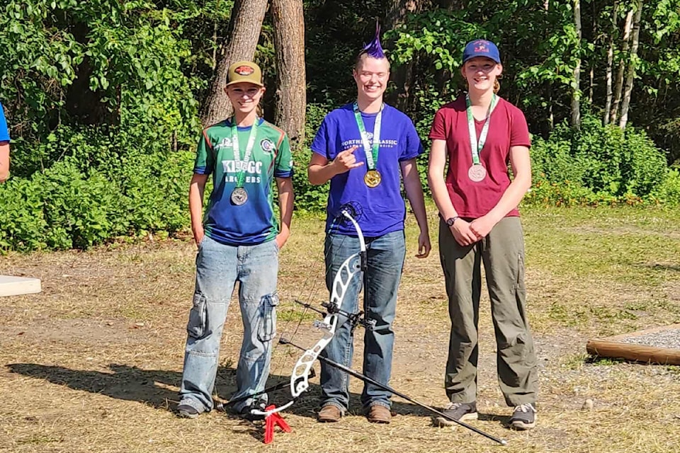 Addyson Kruchkowski (Kelowna and District Archery Club), from left, Lily Fraser, winning gold, and Heidi Schaer.