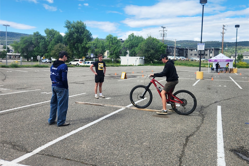 High school mountain bike team members help young riders get their wheels under them at the Bike Rodeo on June 1, 2025.