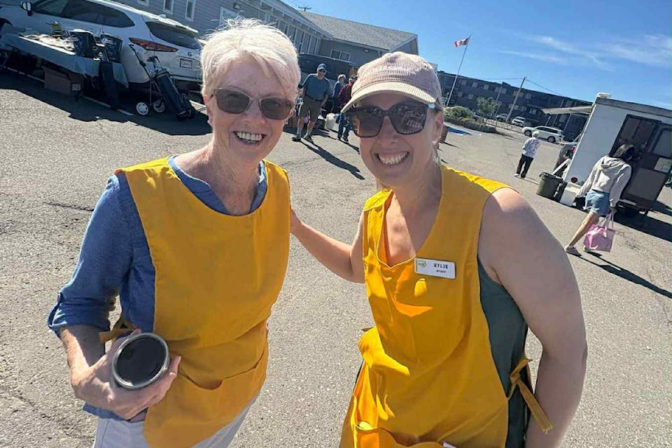 Tina Derksen, left, and Kylie Green, right, from the Seniors Activity Centre, help organize a Junk in the Trunk event on June 7.