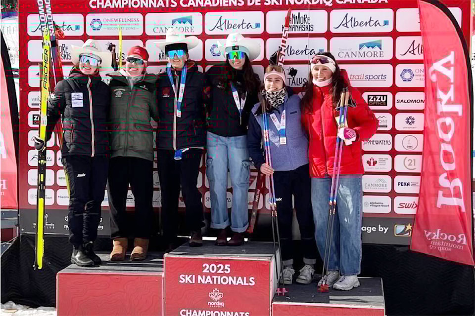 Anika Wallin, left, on top of the podium at Canmore for the 2025 Nordiq Canada national cross country ski championships.