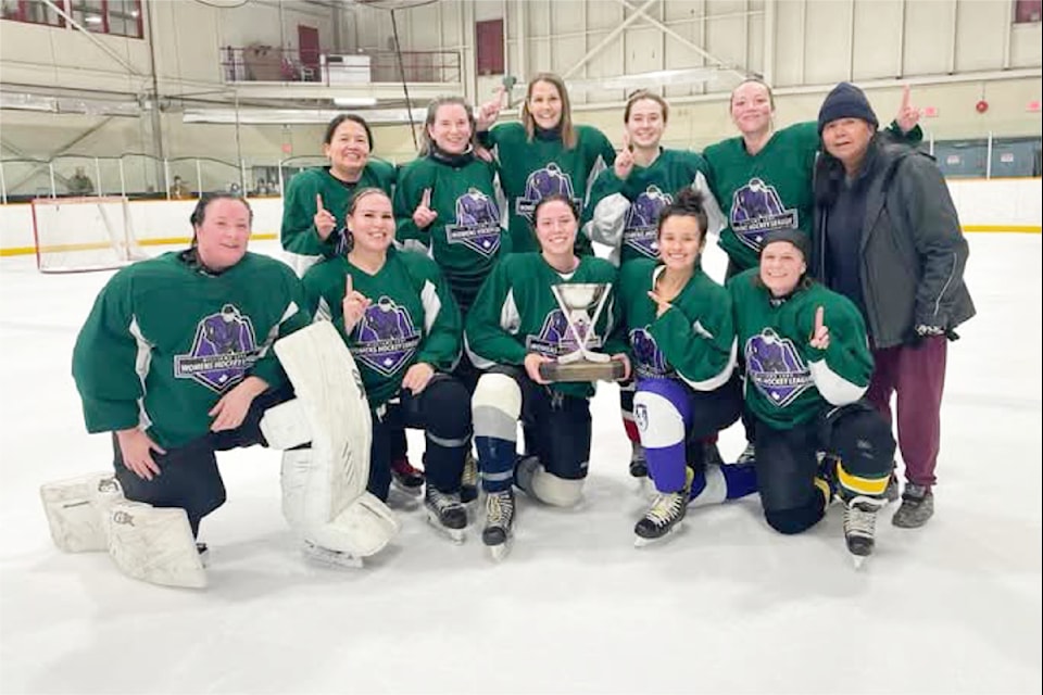 Team Green, a.k.a., Cash Money, pose with the league trophy after winning the playoffs.