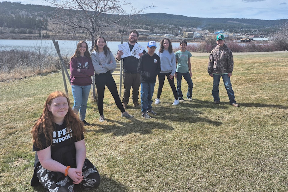 Alex Mutch teaches students about invasive species.