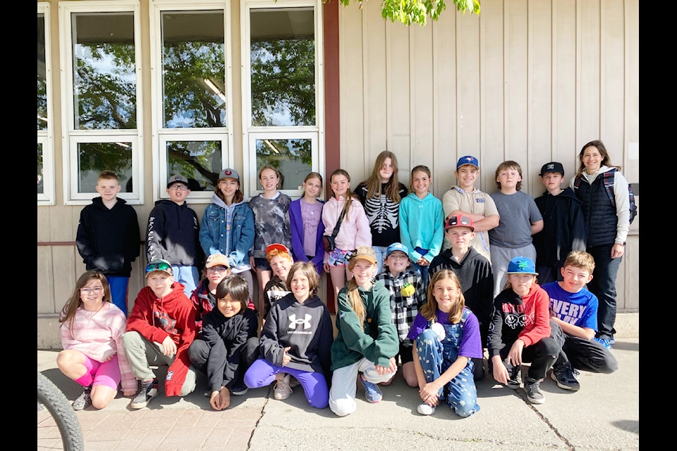 Grade 5 and 6 students from 150 Mile Elementary organize a food drive in their school and donate 1,000 food items to Salvation Army.