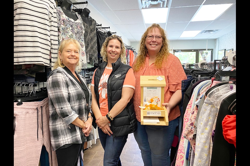 Williams Lake Hospice Society volunteers Karla Leclerc and Lindsey Bifford, as well as program coordinator Sheri Marsh, are helping to run the new Good Buys Thrift Boutique in Williams Lake. 