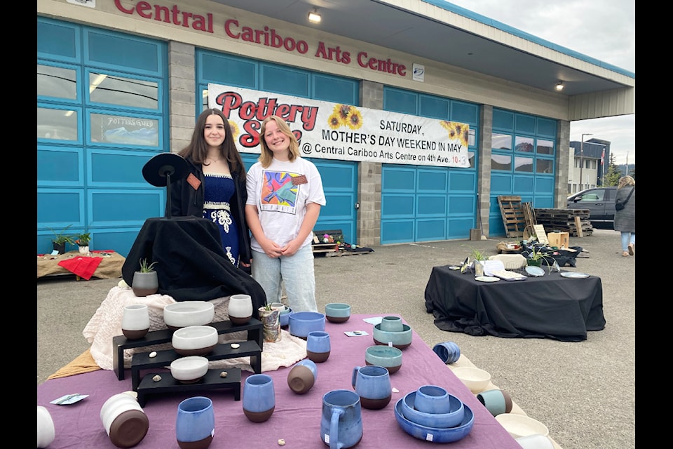 Members of the Cariboo Potters' Guild Talana Brown-John and Annabelle Greig help out at the guild's Mother's Day weekend pottery sale in Williams Lake. 