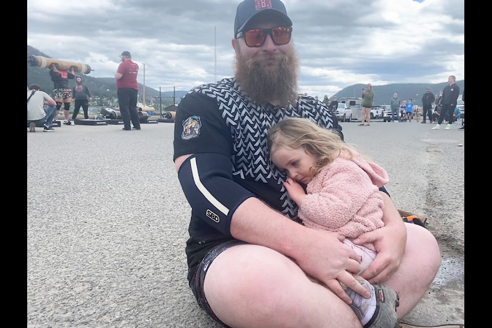 Dan Ursino hugs his daughter Blake after lifting over 200 lbs in the regional Cariboo Strongest competition in Williams Lake. Ursino is just breaking into the open class in his second year lifting in strongman competitions which he said he's doing for his daughters.