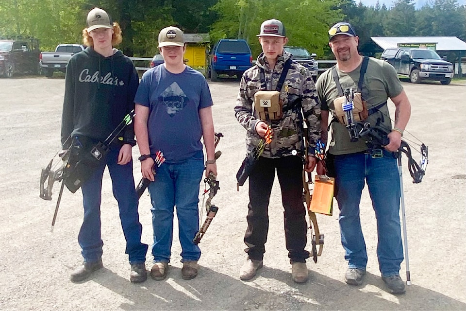 Celton Racquarth, from left, Owen Shettler, Hudson Huska, and Dan Huska with their bows at the 3D fun shoot May 10, 11.