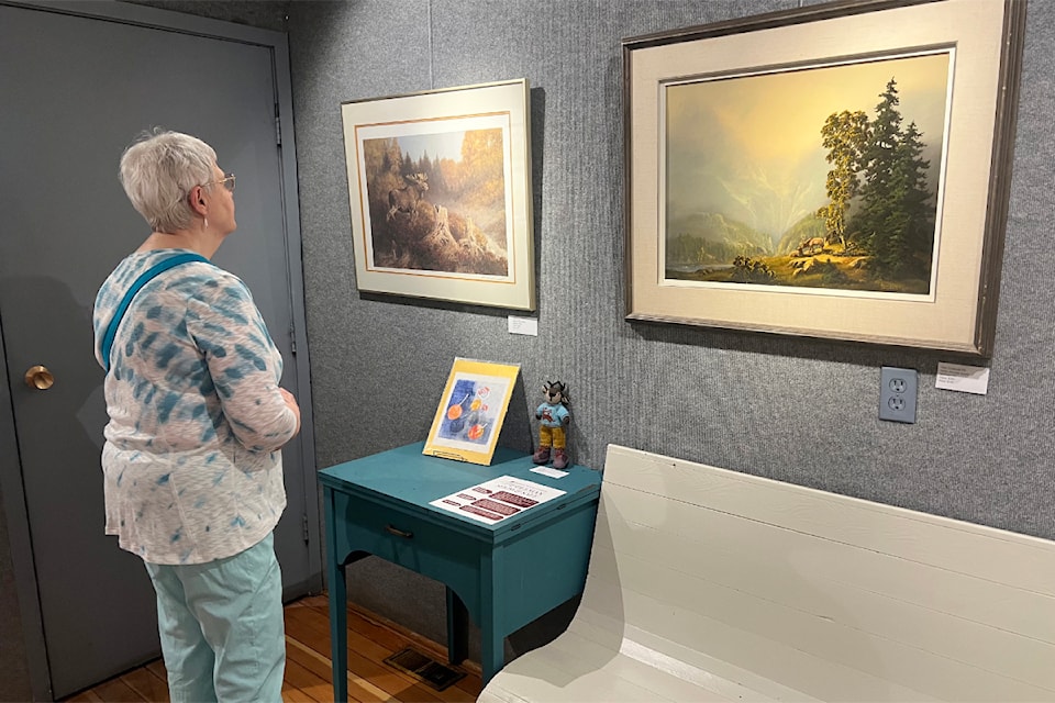 An opening reception attendee at the Middle Man show & Sale on May 1.