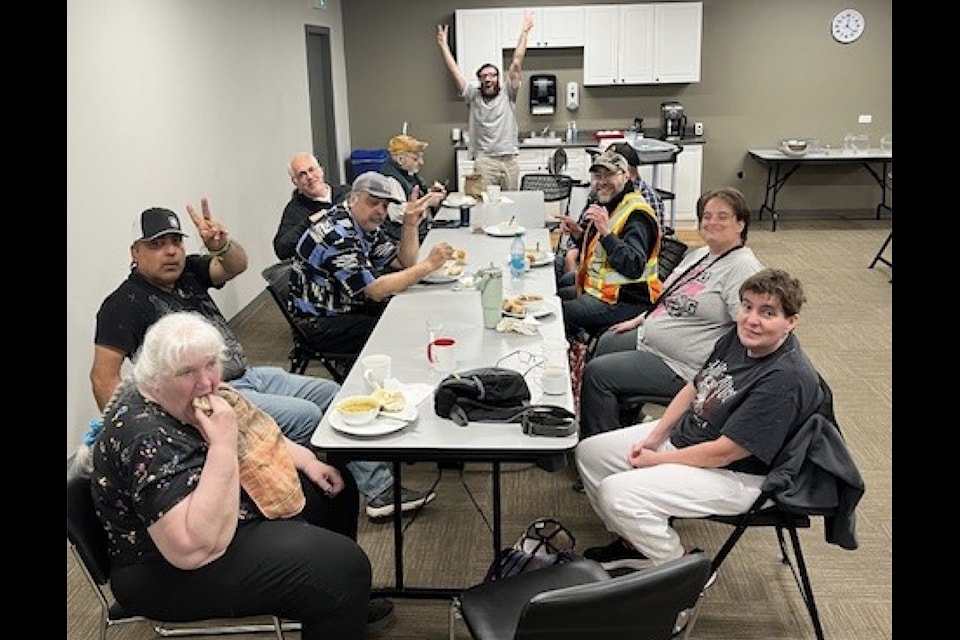YCS Challenger Program participants and support workers enjoy lunch at the Soup Kettle program. 
