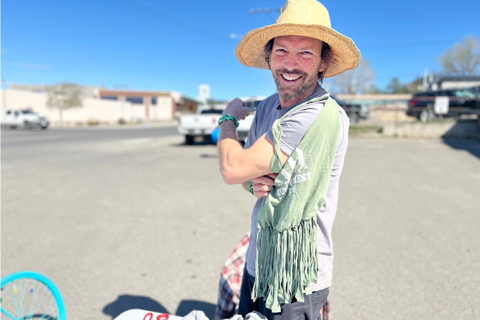 Oliver Berger shows off one of the t-shirt bags he was helping people make at the Free Your Threads event on April 27 in Williams Lake.
