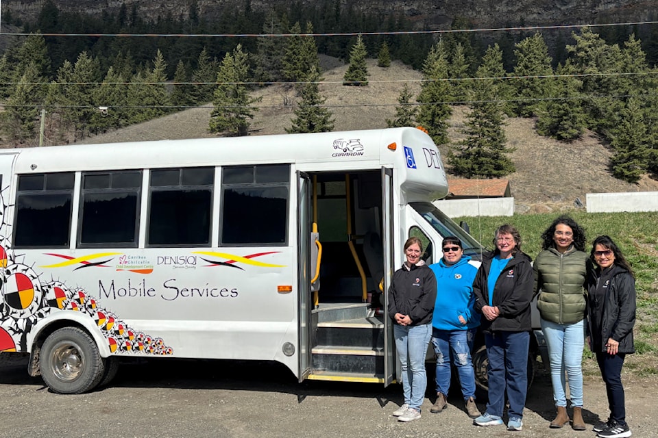 Indigenous Child and Youth Mobile Therapy Services team with their bus for the Cariboo Chilcotin. 