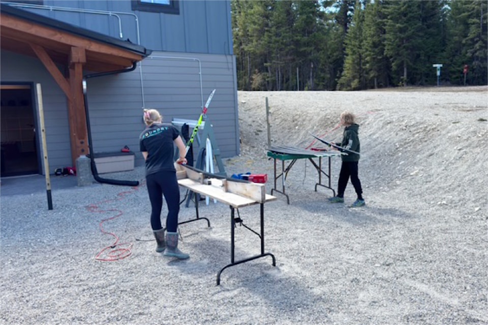 Nadia Wallen and Mica Wallen work outside the lodge during a work bee on April 27 for the Williams Lake Cross Country Ski Club.