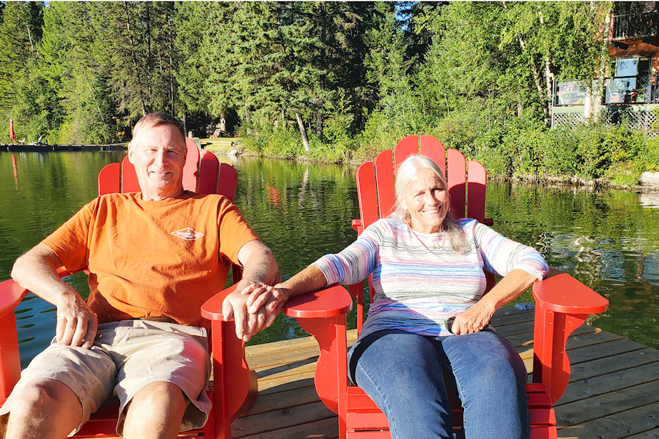 Graham Smith and Claudia Blair Smith enjoy new chairs on their new deck at their Tyee Lake Home. 