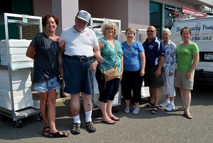 mly Meals on Wheels volunteers with trays